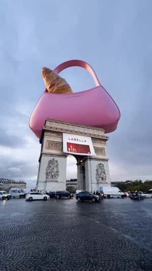 Croissant Peeking from Handbag in a fake-out-of-home ad of Labella
