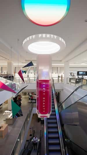 Lip Gloss Descending at Brown Thomas in fake-out-of-home ad of Fenty Beauty