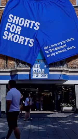Shorts Suspended at Storefront in a fake-out-of-home-ad of Lifestyle Sports