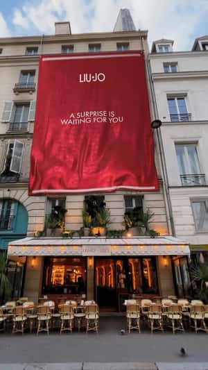 Red Banner Drapes Down Building in a fake-out-of-home ad of Liu Jo