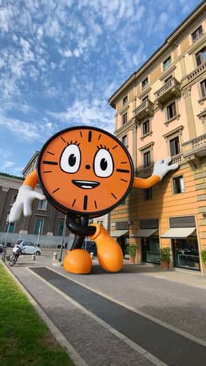 Clock Mascot Stands Beside Building in a fake-out-of-home ad of Marvel
