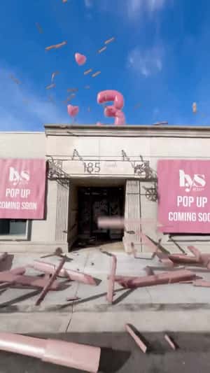 Pink Heart Balloons Pop at Shop in a fake-out-of-home ad of LYS Beauty