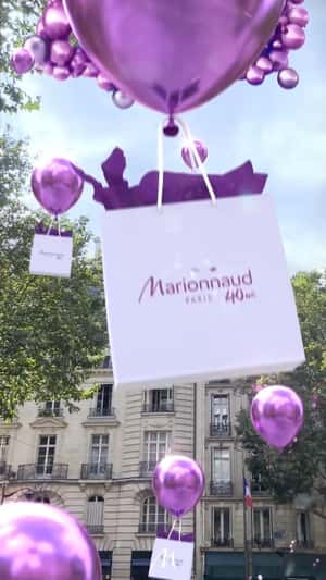 Purple Balloons Lift Shopping Bags in a fake-out-of-home ad of Marionnaud