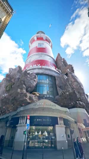 Facade Becomes Lighthouse in a fake-out-of-home ad of Le BHV Marais