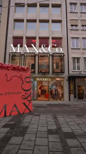 Shopping Bag Arrives on Conveyor in a fake-out-of-home ad of MAX&Co.