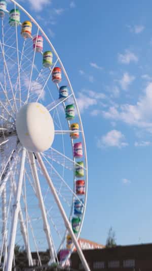 Ferris Wheel with Gum Container Wagons in a fake-out-of-home ad of Mentos