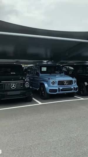 SUVs Parked Under Glass Street in a fake-out-of-home ad of [brand]