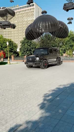 Parachutes Deliver SUVs in a fake-out-of-home ad of Mercedes-Benz