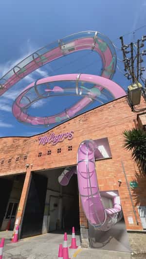 Hairbrushes Glide on Water Slide in a fake-out-of-home ad of Milagros