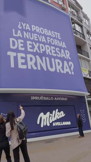 Chocolate Bars Flow from Building in a fake-out-of-home ad of Milka