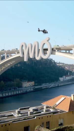 Helicopter Places Logo on Bridge in a fake-out-of-home ad of MO