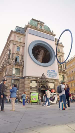 Sneaker Spins in Washing Machine in a fake-out-of-home ad of Moab SneakCare