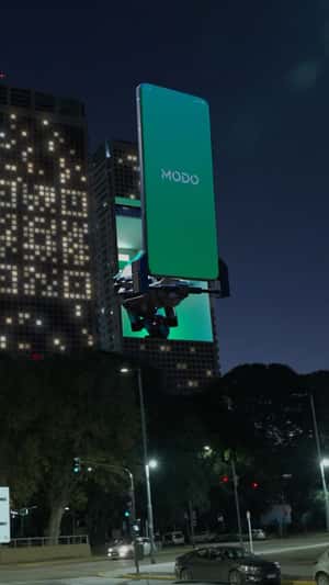 Phone Reads Window QR Lights in a fake-out-of-home ad of MODO