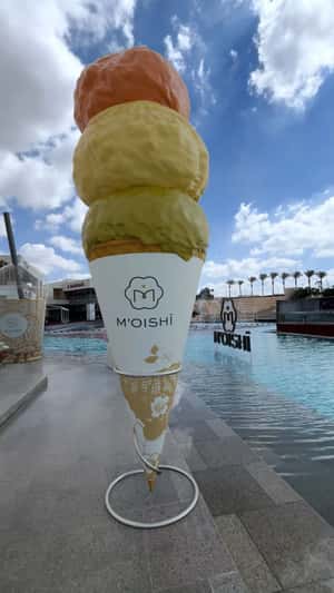 Dessert Monuments Beside Lake in a fake-out-of-home ad of Moishi
