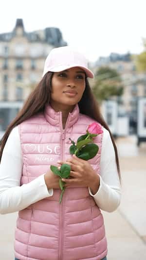 Pink Roses Bloom on Clock Tower in a fake-out-of-home ad of Musc Intime