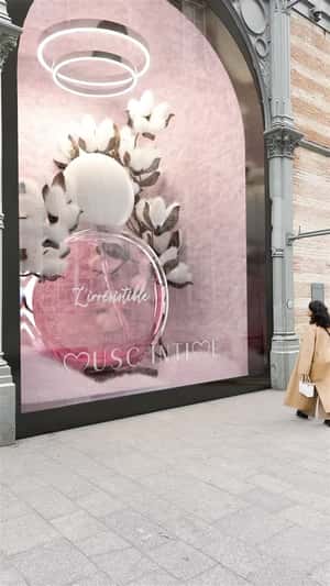 Cotton Blooms Beside Perfume Bottle in a fake-out-of-home ad of Musc Intime