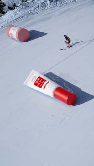 Beauty Items Glide Across Snow Park in a fake-out-of-home ad of Musc Intime