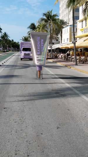 Truck Smashes Sunscreen to Pieces in a fake-out-of-home ad of Naked Sundays