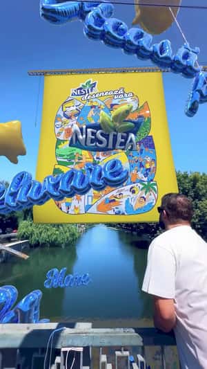 Brand Logo Emerges from Banner in a fake-out-of-home ad of Nestea