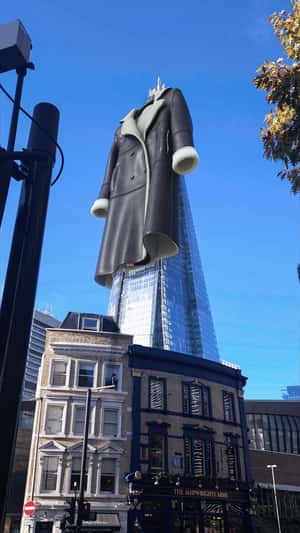Winter Coat Hangs on Shard in a fake-out-of-home ad of New Look