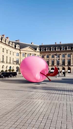 Pink Apple Bounces at Plaza in a fake-out-of-home ad of Nina Ricci