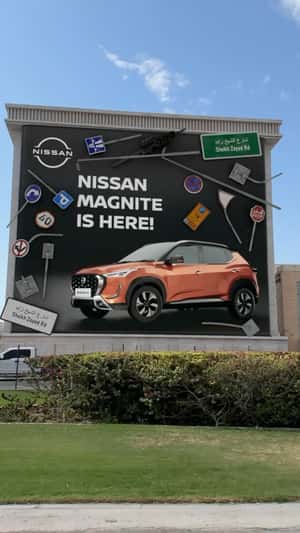 Road Signs Magnets on Billboard in a fake-out-of-home ad of Nissan