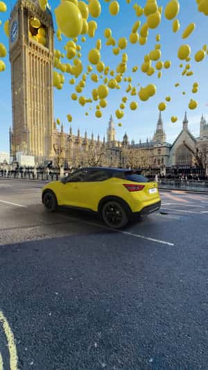 Yellow Balloons Fly from Big Ben in a fake-out-of-home ad of Nissan