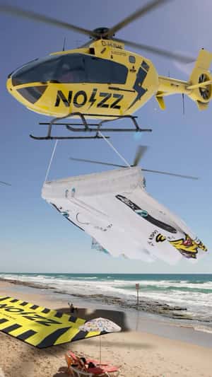 Helicopter Transports Beachwear in a fake-out-of-home ad of Noizz by Mania