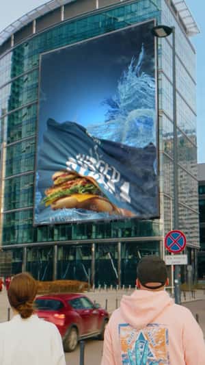 Fisherman's Burger Emerges in Water from Billboard in a fake-out-of-home ad of North Fish