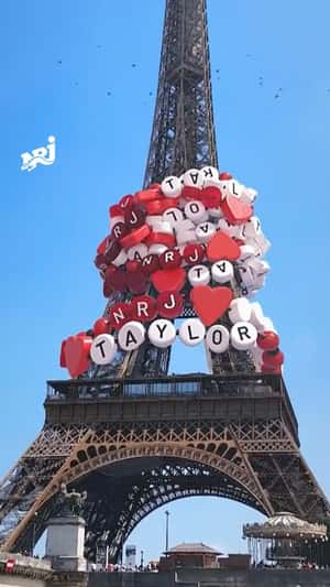 Taylor Swift Bracelets on Eiffel Tower in a fake-out-of-home ad of NRJ