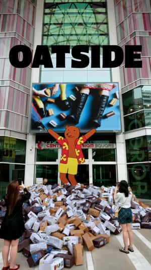 Cartons Spill as Giant Claw Lifts Box in a fake-out-of-home ad of Oatside