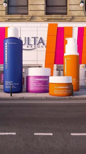 Giant Orange Rolls as Products Drop in a fake-out-of-home ad of OLEHENRIKSEN