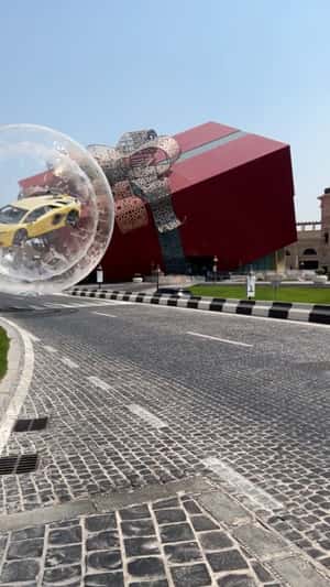 Yellow Ferrari Rolls Inside Bubble in a fake-out-of-home ad of Ozone