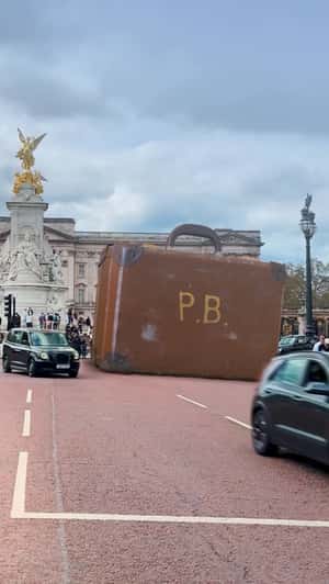 Giant Suitcase Appears at Buckingham Palace in a fake-out-of-home ad of Paddington the Musical