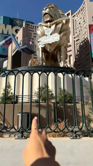 Medallion Worn by MGM Grand Lion in a fake-out-of-home ad of Palm Tree Beach Club