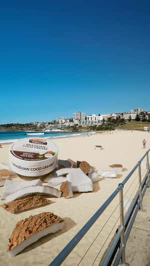 Massive Coconut Crashes on Bondi Beach in a fake-out-of-home ad of Palmer's