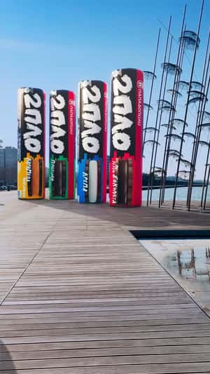 Giant Chocolate Bars Tower Over Waterfront in a fake-out-of-home ad of Papadopoulos