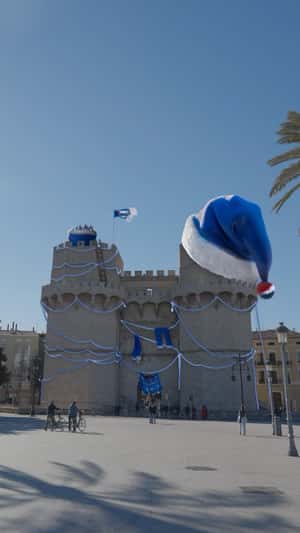 Giant Blue Santa Hat in Serranos Towers in a fake-out-of-home ad of Pepsi