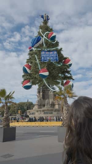 Giant Chritmas Tree in Barcelona in a fake-out-of-home ad of Pepsi