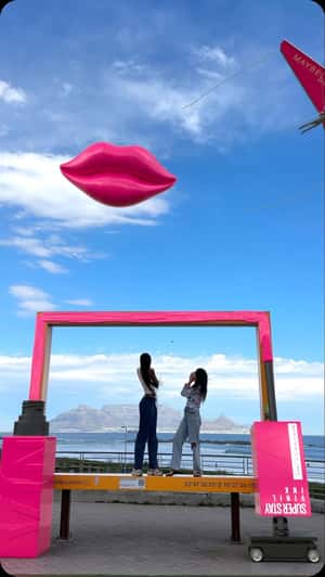 Oversized Lip Gloss paragliding fake out of home ad of maybelline