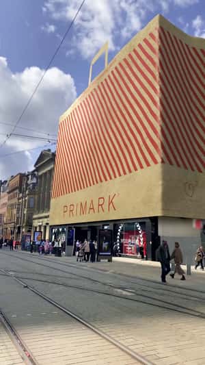 Christmas Balls Roll from Paper Bag in fake-out-of-home ad of Primark