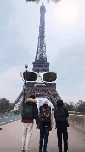 Eiffel Tower with Glasses and Wig in a fake-out-of-home ad of Michel Polnareff