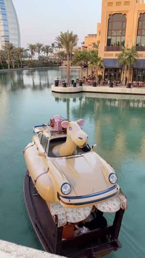 Porcshe-Camel Hybrid Boat Floats Dubai Waters in a fake-out-of-home ad of Porsche