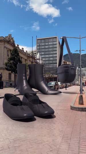 Giant Shoes and Bag in City Square in a fake-out-of-home ad of Punto Blanco
