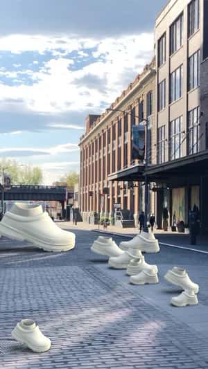 Various Sizes Slippers Walking in fake-out-of-home ad of UGG