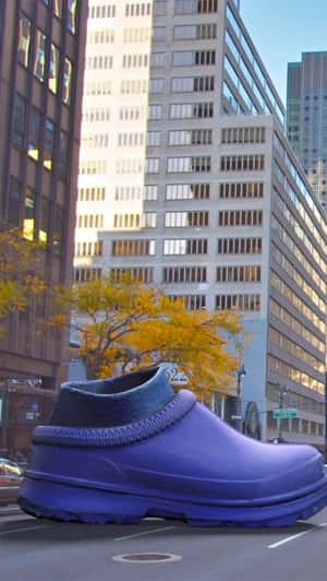 Giant purple Purple Slipper Street Landing in fake-out-of-home ad of UGG