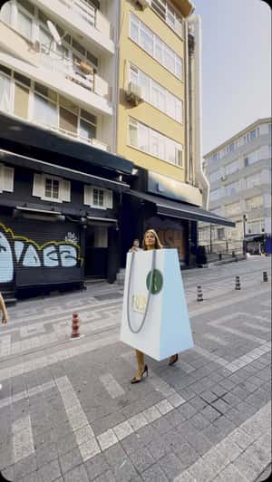 Woman in Giant Shopping Bag in a fake-out-of-home ad of Reis