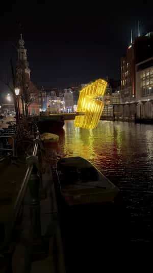 Massive Gold Number 5 Over Amsterdam Canals in a fake-out-of-home ad of Renault