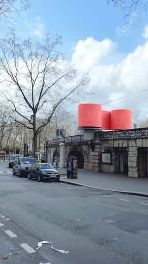 Train Passes Through Giant Red Roll in a fake-out-of-home ad of Renova