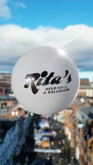 Giant Ball Rolls Over Leeds Skyline in a fake-out-of-home ad of Rita's
